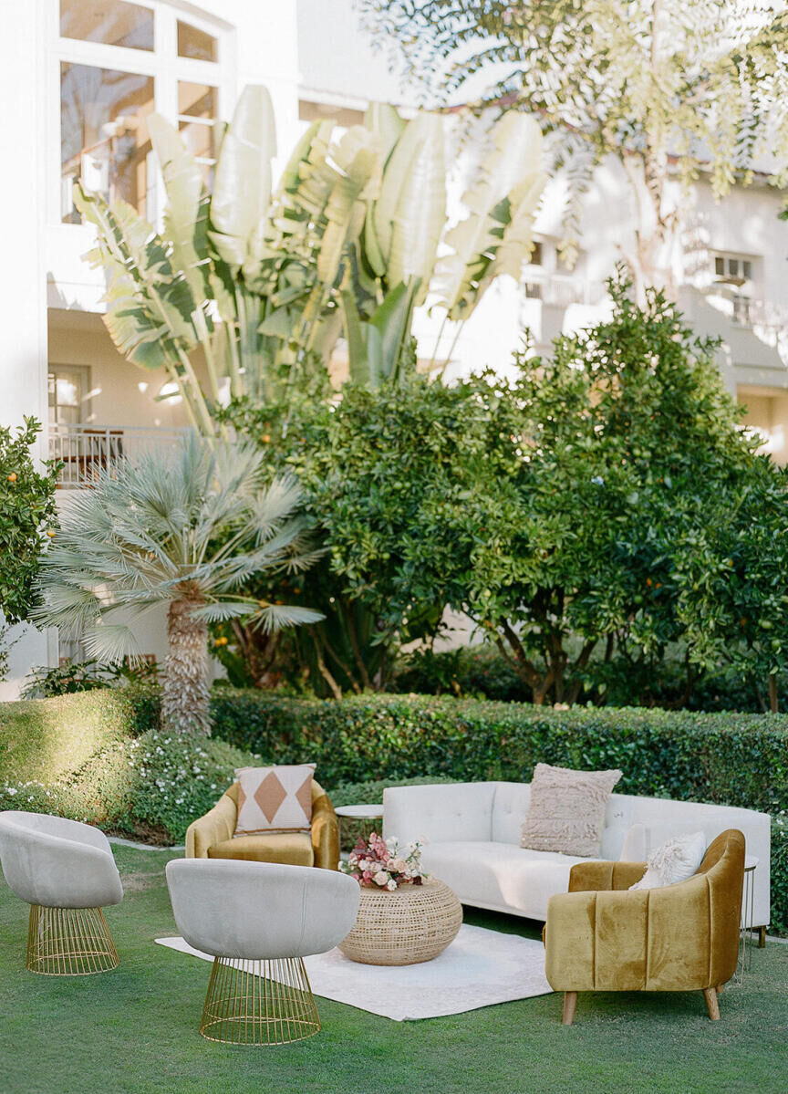 A curated selection of rental pieces set up as a lounge area at an earth tone wedding.