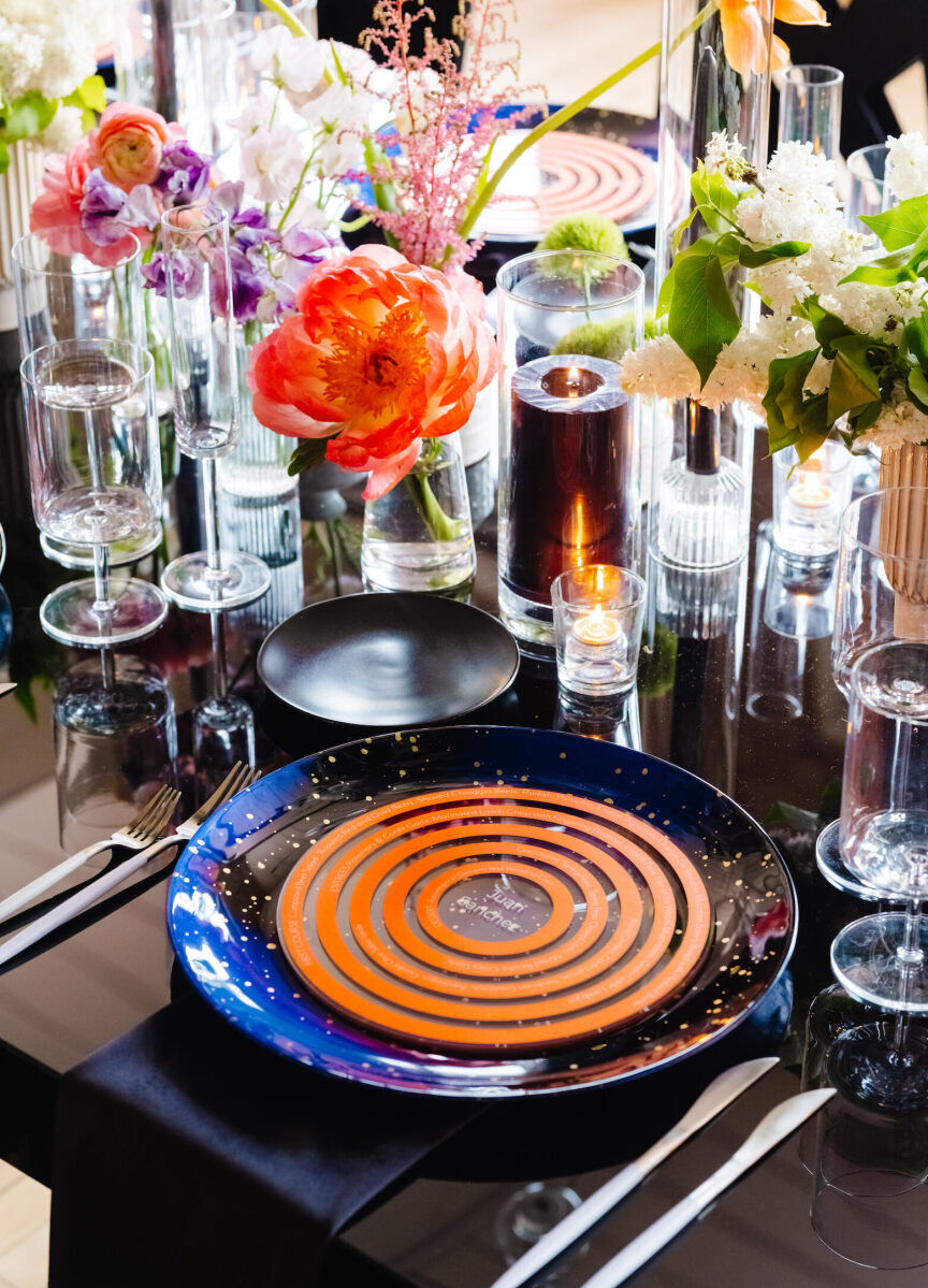 Orange spirals adorned the acrylic menus at an art museum wedding.