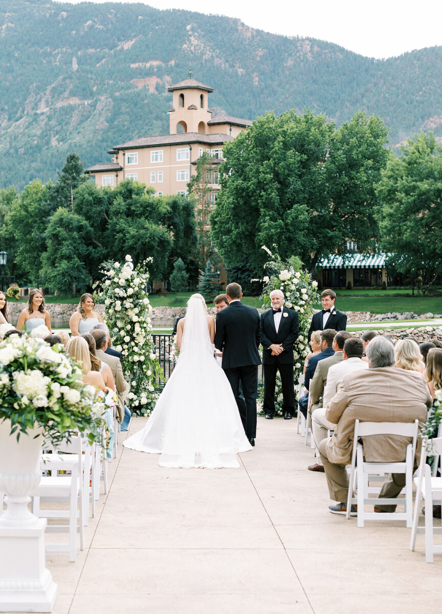 Wedding couple standing at the alter in front of guests at their Mountain View wedding ceremony