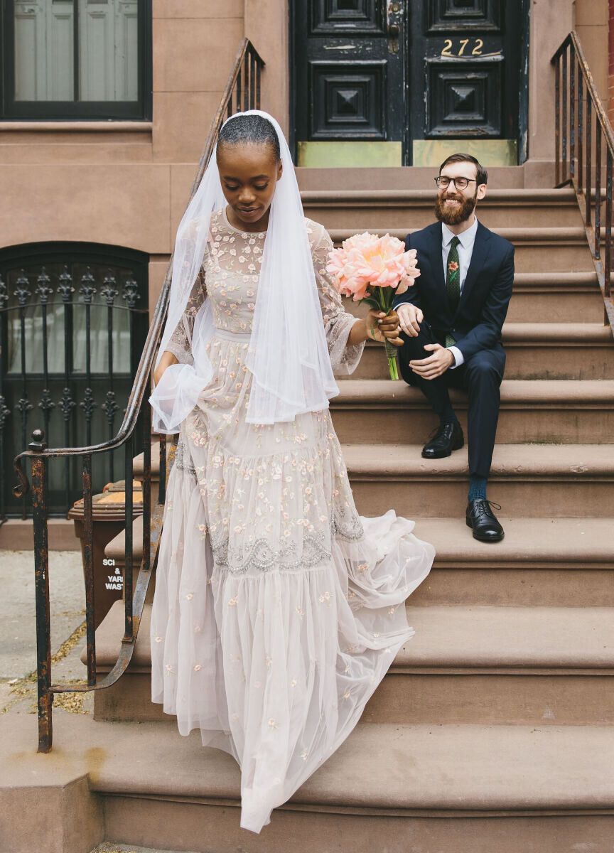 Average Wedding Dress Cost: White wedding dress with pink and grey lace embellishments