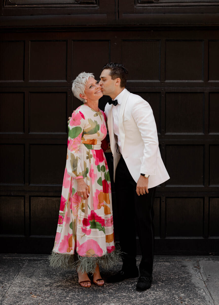 Best Mother of the Bride Dresses: A garden party floral with a festive feather trim.