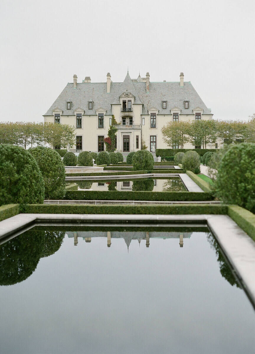 Castle Wedding Venues: A castle property on Long Island with a manicured garden full of small ponds.