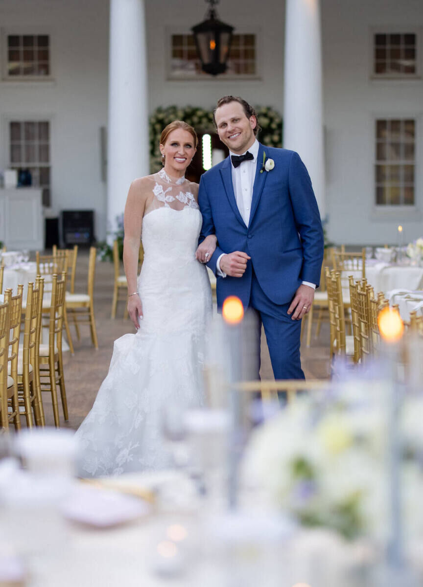 City Weddings: A wedding couple smiling in the center of their outdoor wedding reception in Dallas.