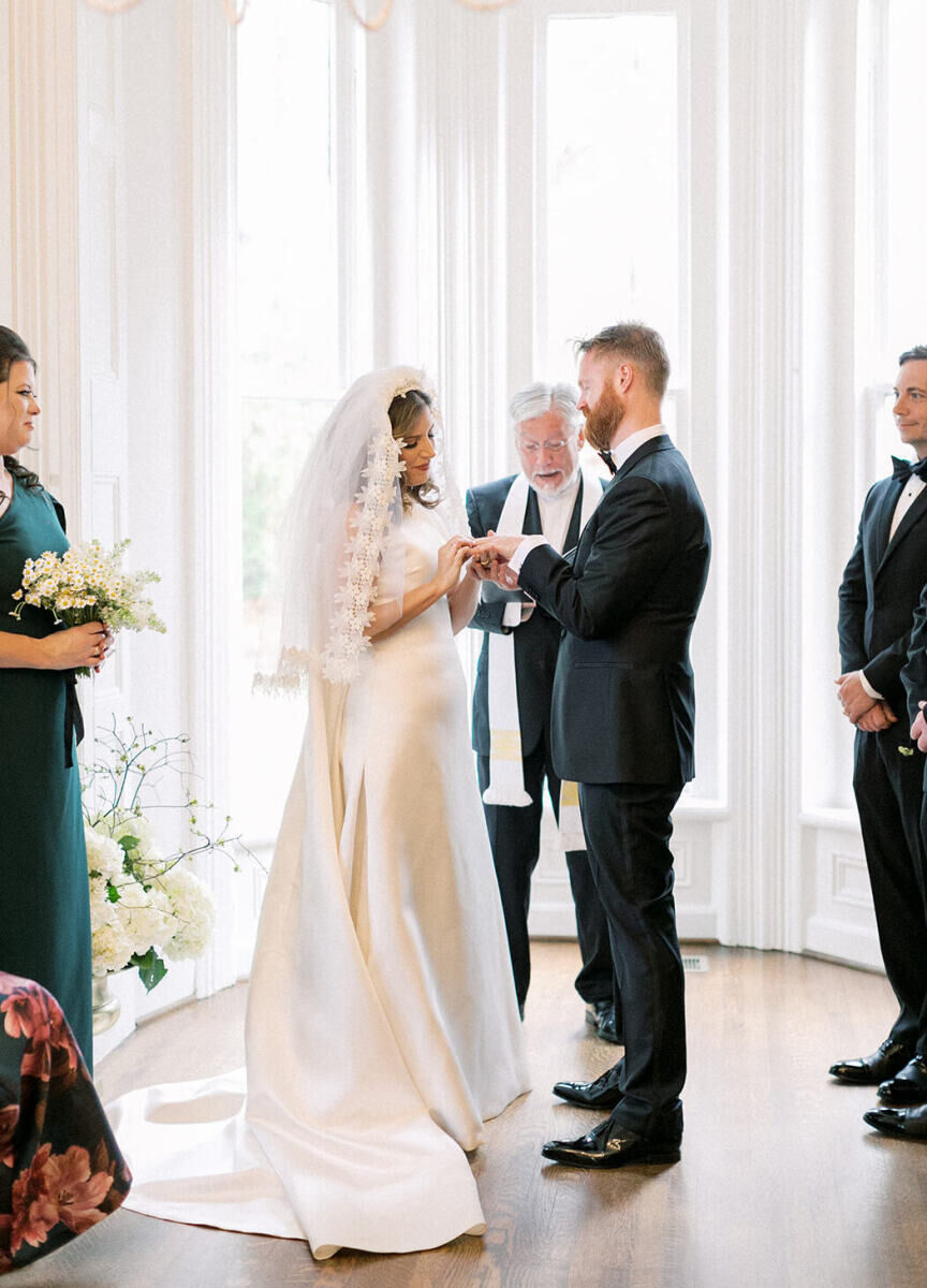 A couple exchanging rings during their wedding ceremony.