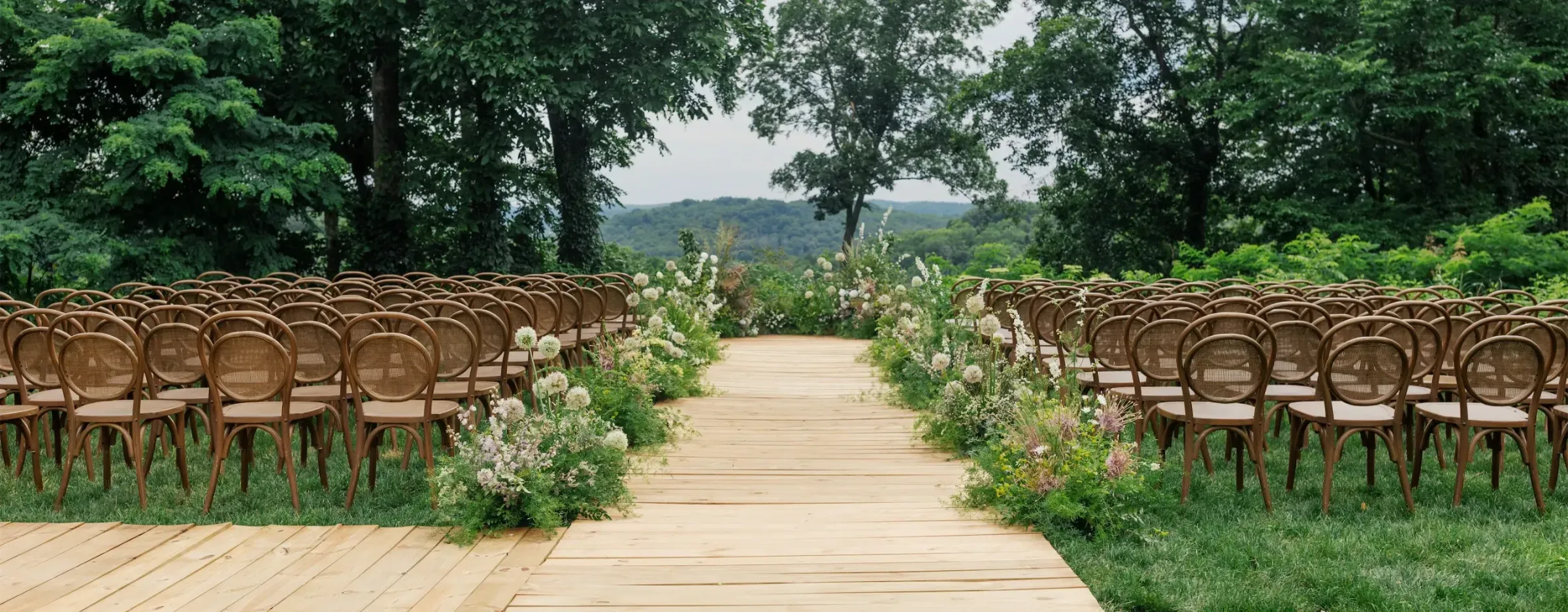 An outdoor ceremony with grounded florals and an angular wooden aisle by Margaret Elizabeth Photography