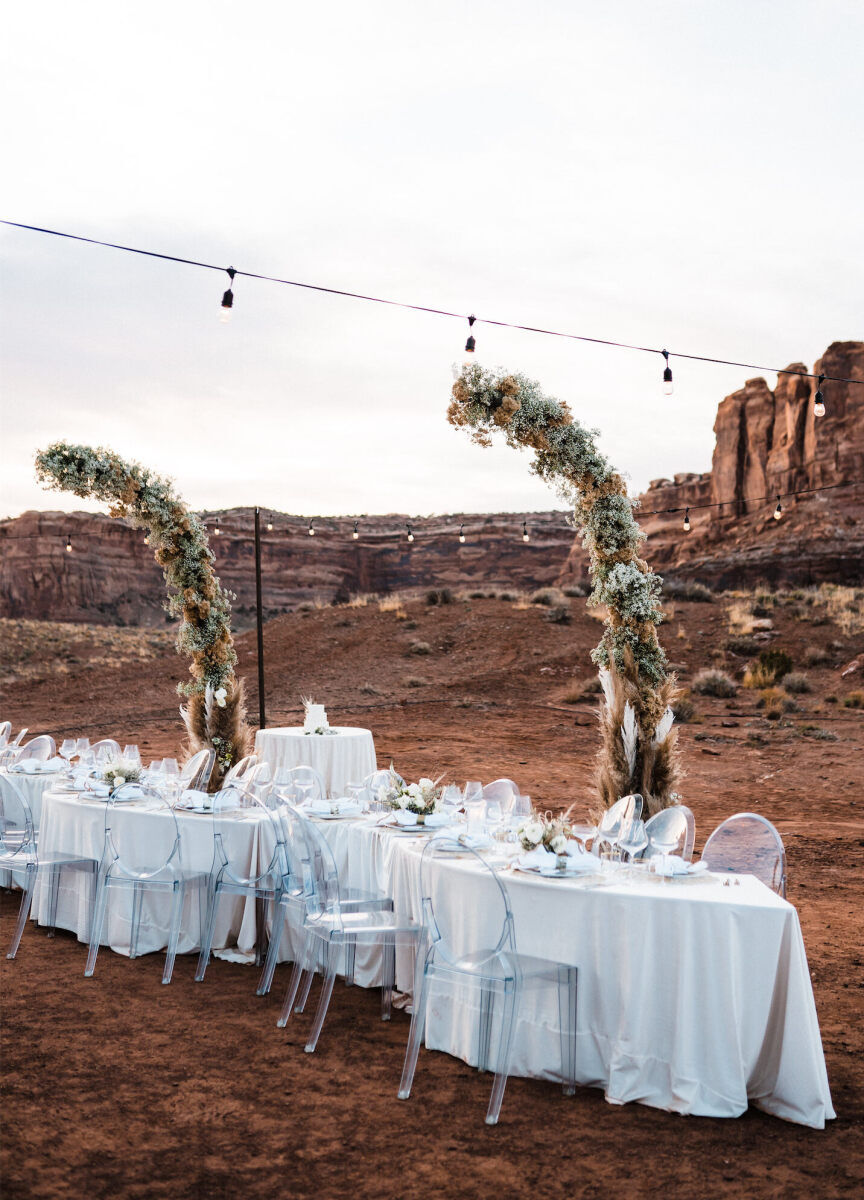 Serpentine tables added some visual interest during the open air reception at this desert wedding.