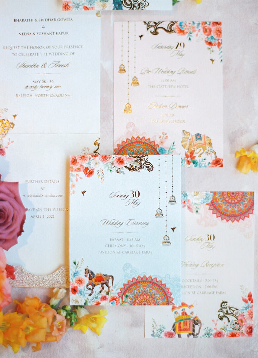 Invitations for a destination Indian wedding weekend comprised of multiple pieces designed in a vibrant color palette.