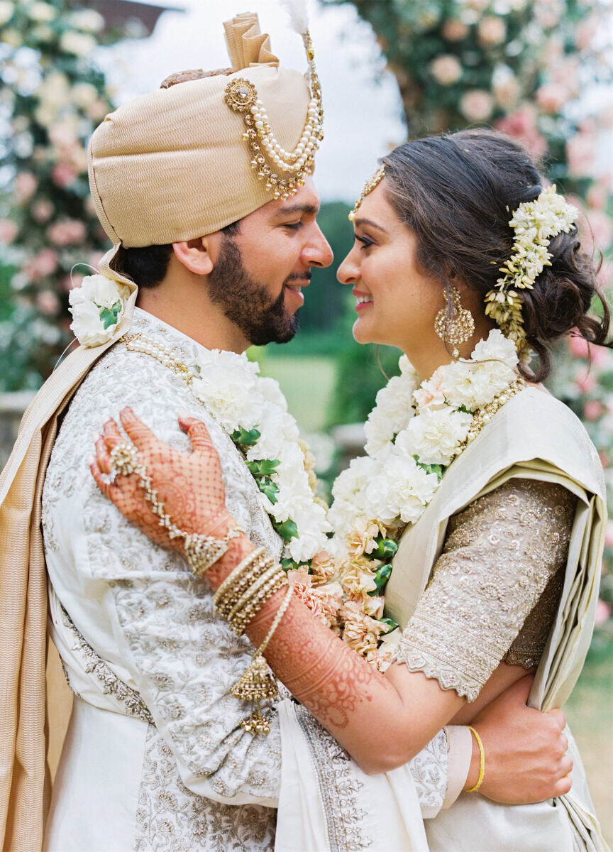 A groom and bride look into each others eyes following the ceremony during their destination Indian wedding weekend in Raleigh, North Carolina.