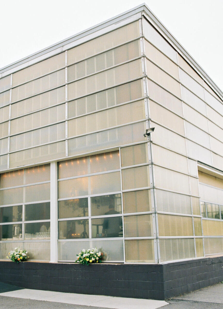 A modern, industrial greenhouse was the setting for the welcome dinner of a destination Indian wedding in Raleigh.