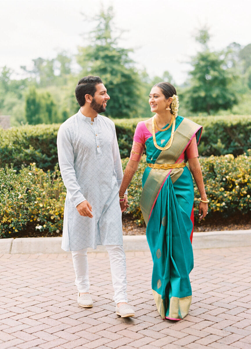 A groom and bride in traditional attire are ready to participate in their engagement ceremony during their destination Indian wedding weekend.