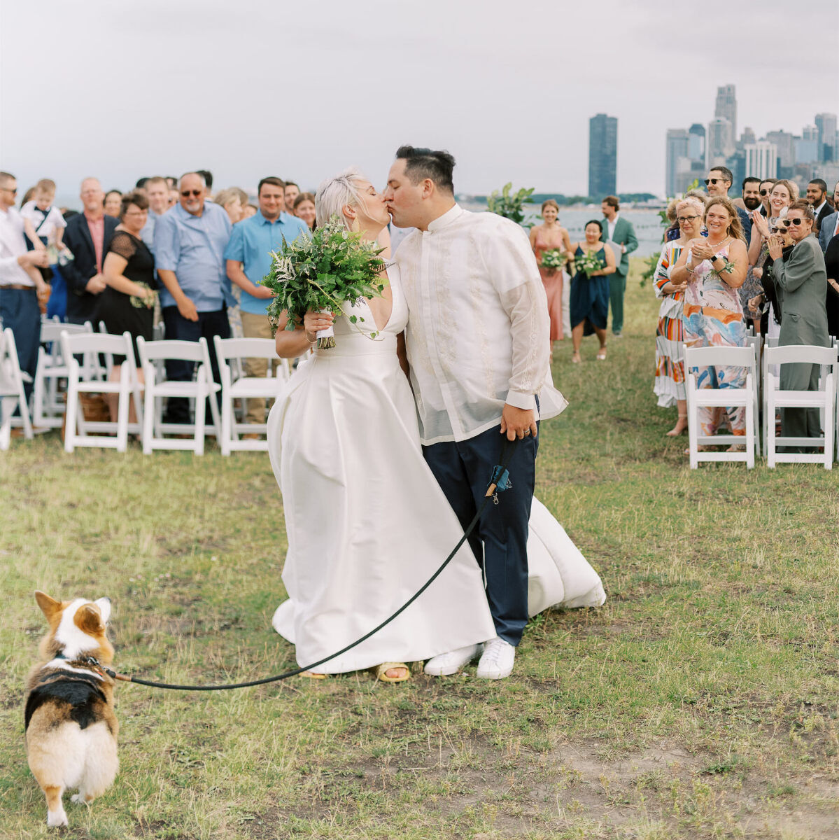 Newlyweds and their dog are photographed post-ceremony at their enchanted waterfront wedding in Chicago.