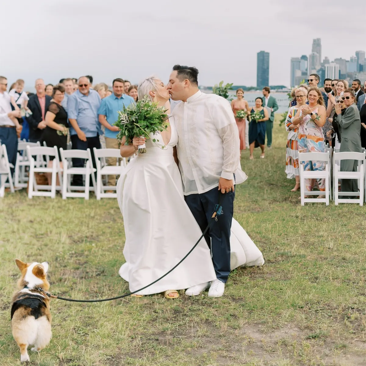 Newlyweds and their dog are photographed post-ceremony at their enchanted waterfront wedding in Chicago.