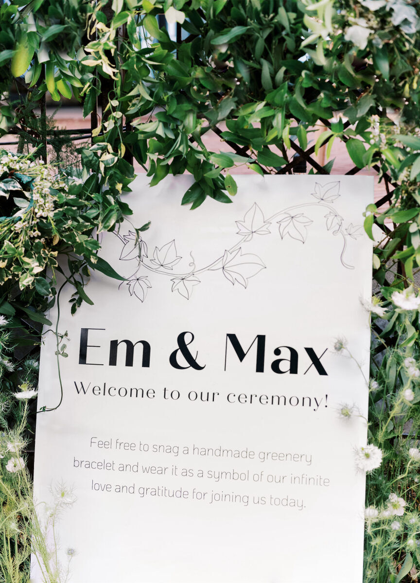 The bride designed the signage at her enchanted waterfront wedding using artwork created by a graphic designer friend.