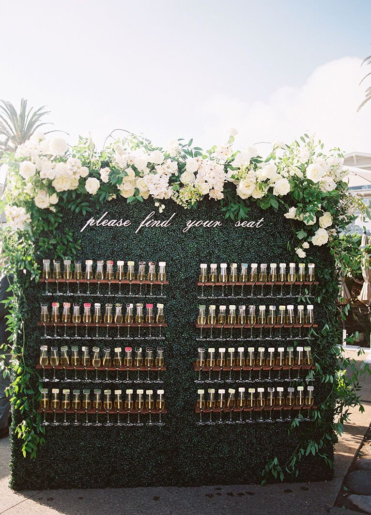 Escort card displays: See more from Lara and Adam's beach wedding