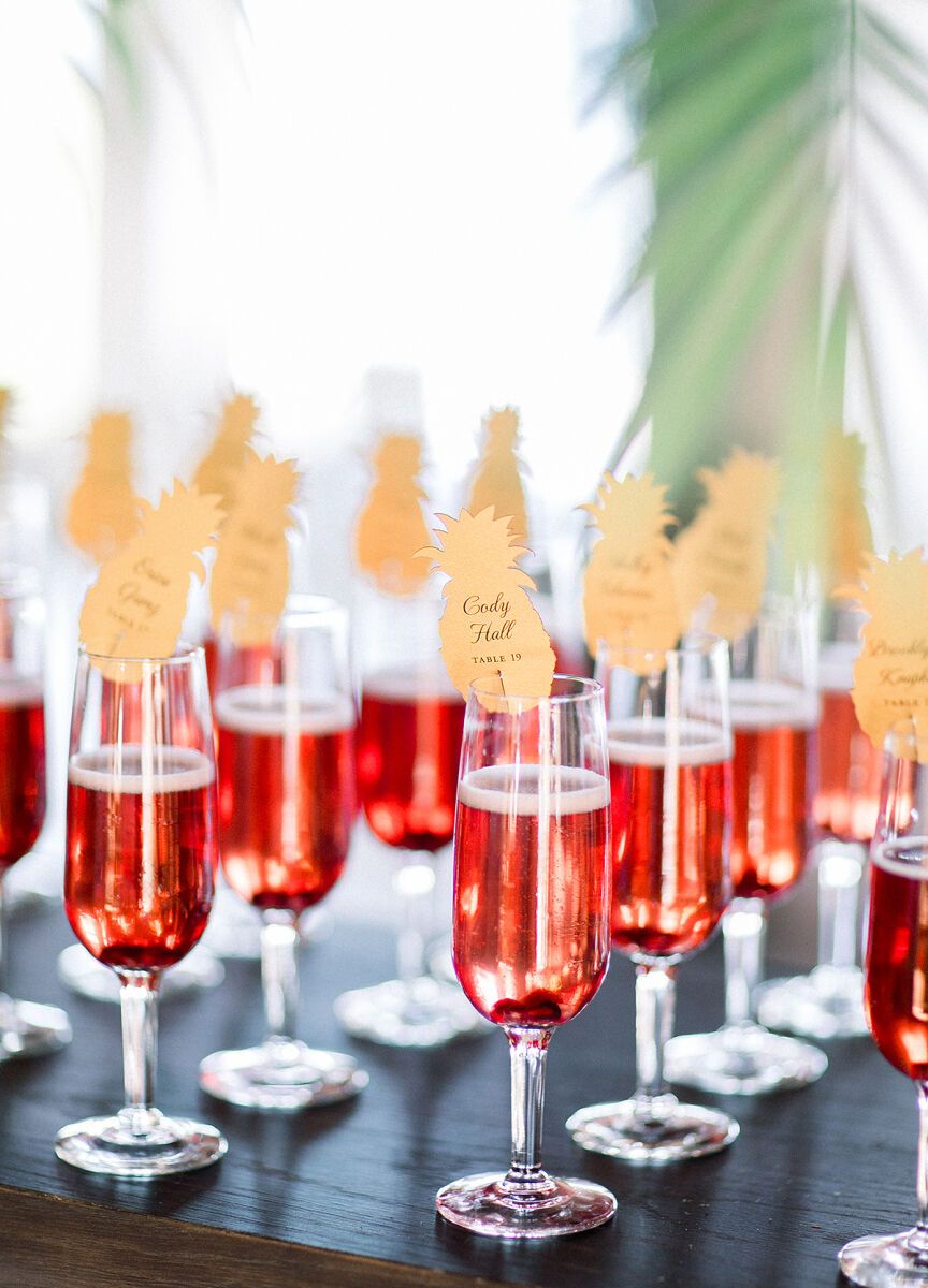 Escort card displays: See more from Taylor and Andrew's beach wedding