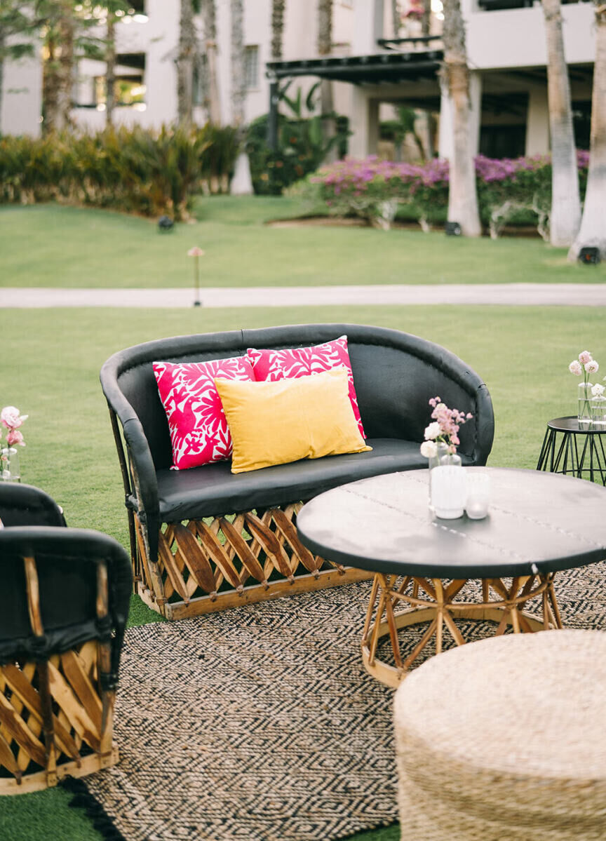 Equipale style lounge furniture was rented from a local Mexican company for a glam beach wedding cocktail hour in Cabo San Lucas.