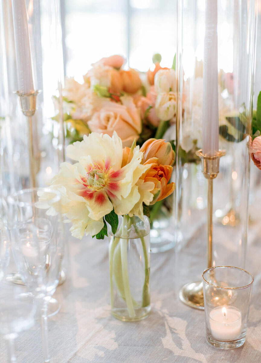 A mix of floral centerpieces and candles adorned the tables at a Glenmere Mansion wedding reception.