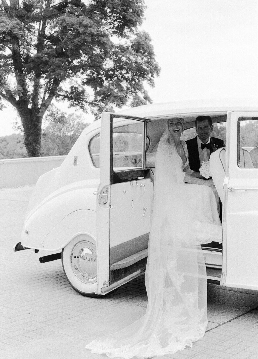 Newlyweds use a rented Rolls-Royce for a photo op at their Glenmere Mansion wedding.