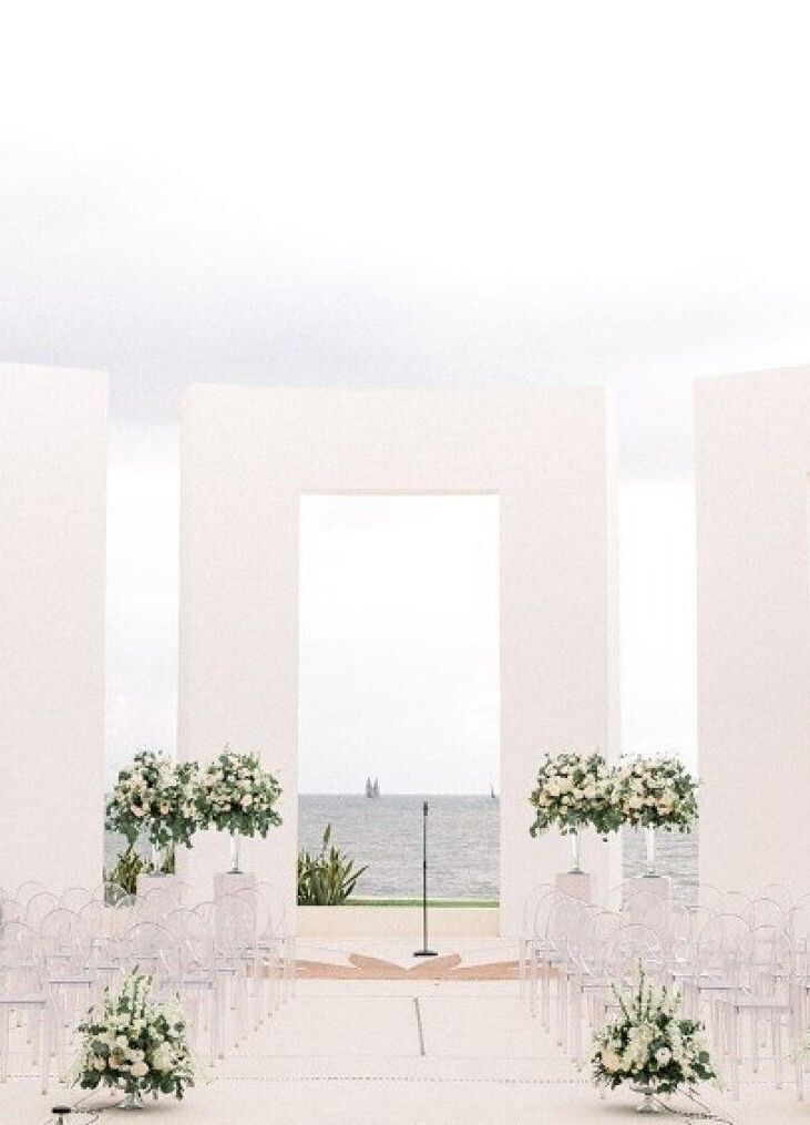 Grand Velas Riviera Nayarit: White floral arrangements scattered throughout a modern gazebo.