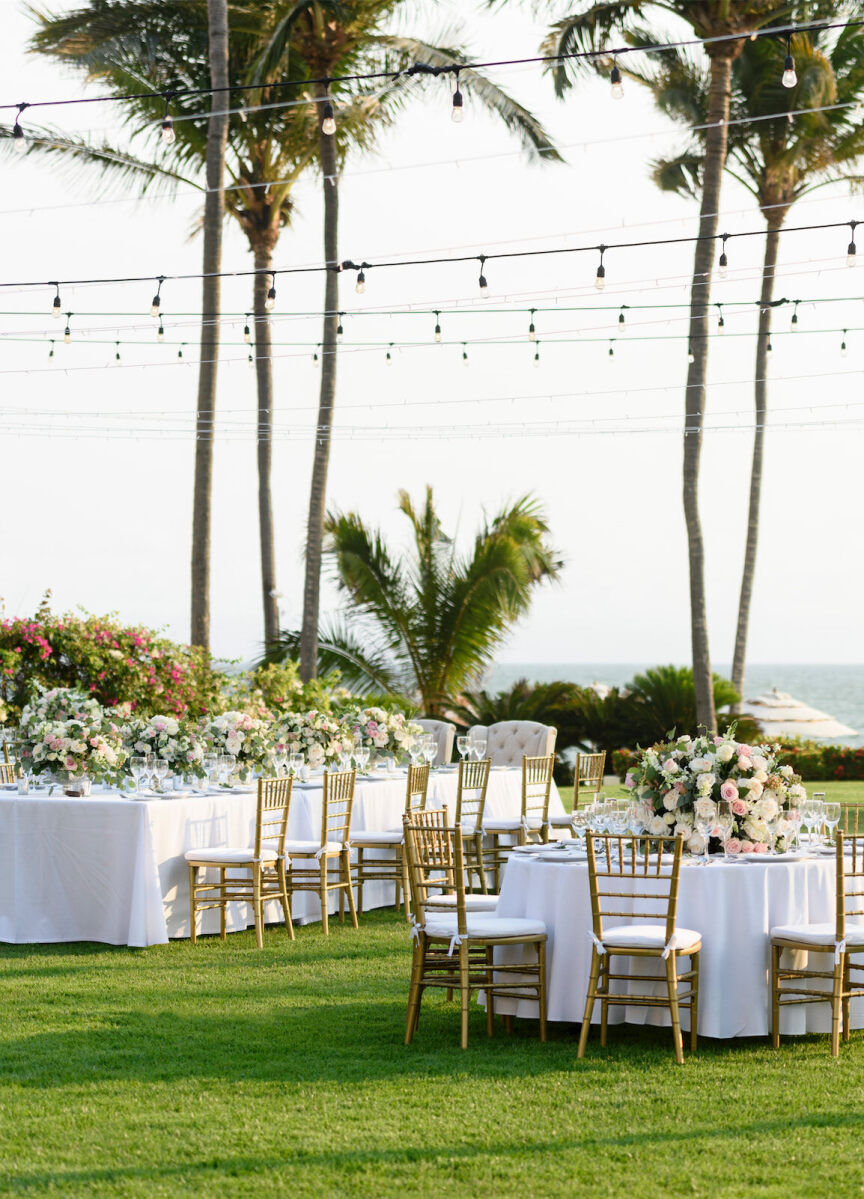 Grand Velas Riviera Nayarit: An outdoor wedding reception with a rectangular and circular shaped table and string lights above.