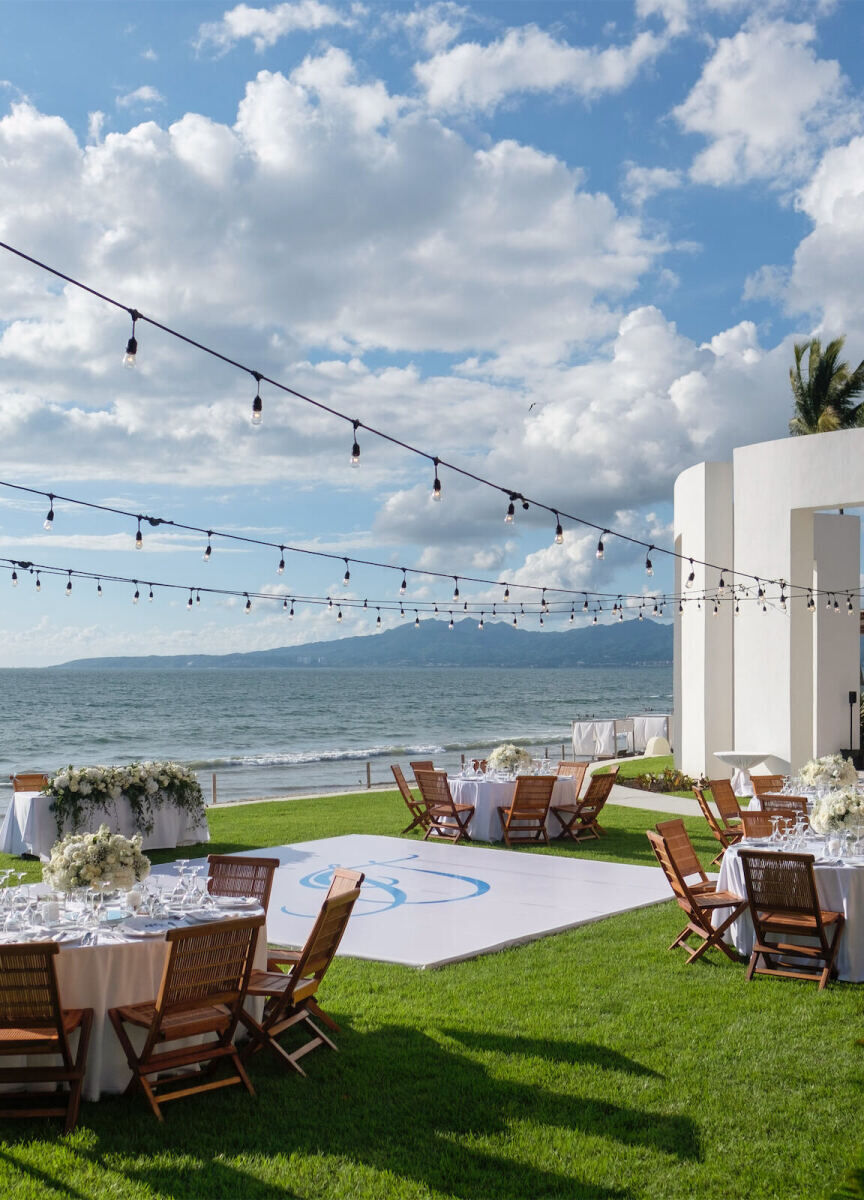 Grand Velas Riviera Nayarit: A grassy reception area with string lights and a dance floor with the bride and groom's initials on it.