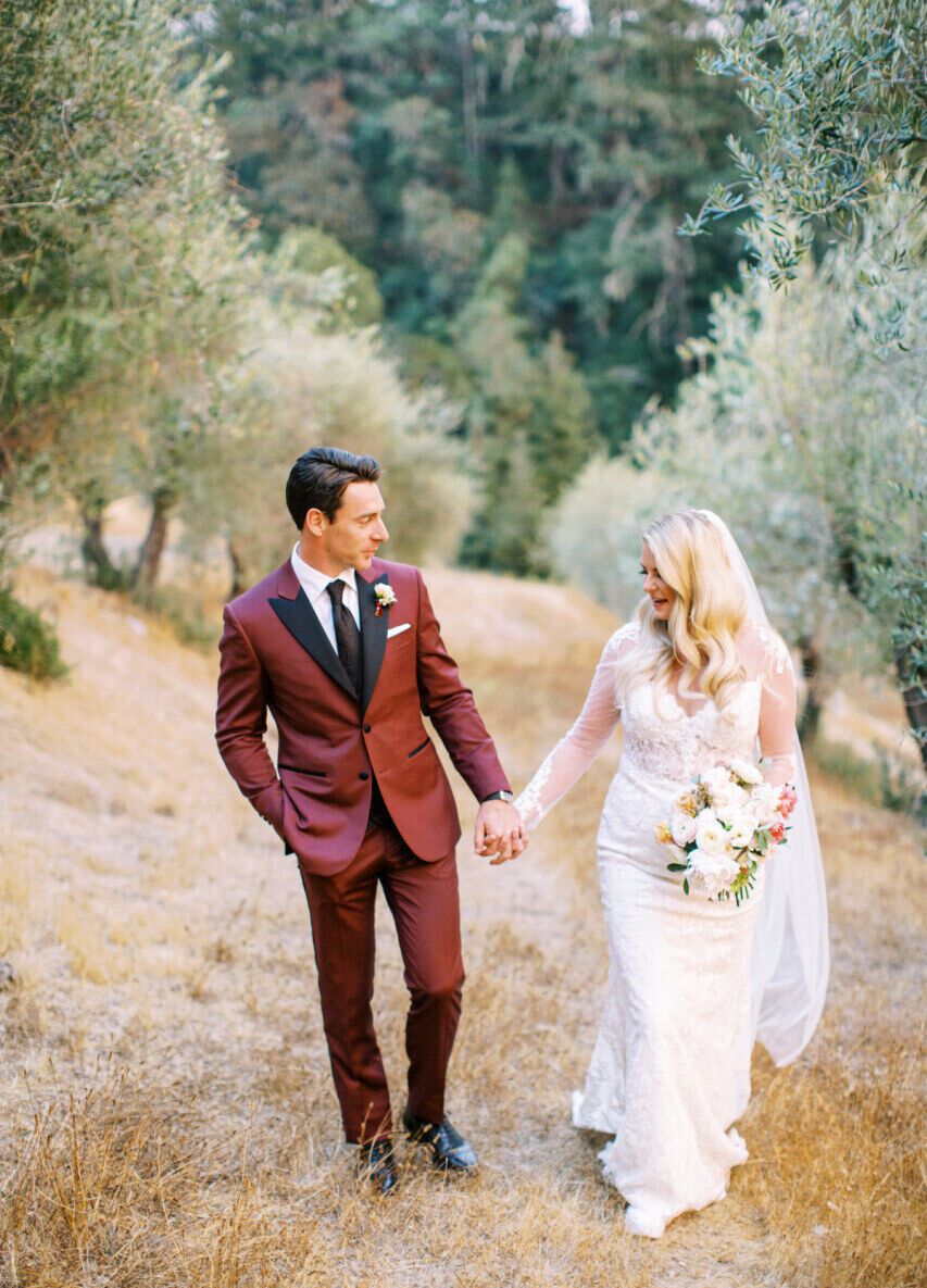 See more maroon suit groom attire from Hailey and Simon's garden wedding