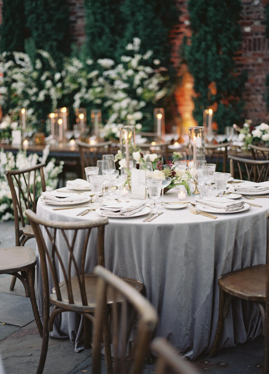 Holiday Wedding: A reception table set with rustic chairs and tableware.