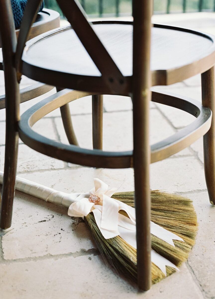 Jump the Broom: Wedding tradition, jumping the broom, broom under chair at ceremony