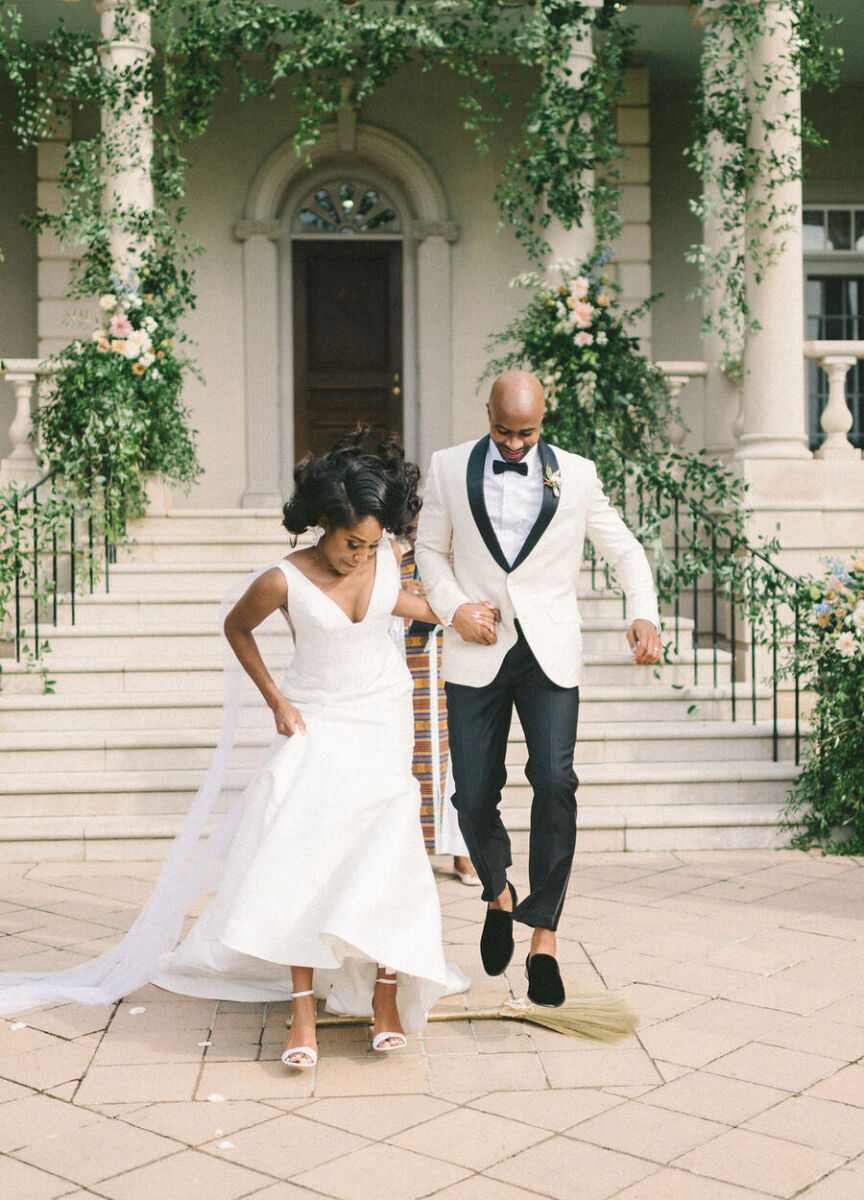 Jump the Broom: Wedding couple participating in the jumping the broom wedding tradition