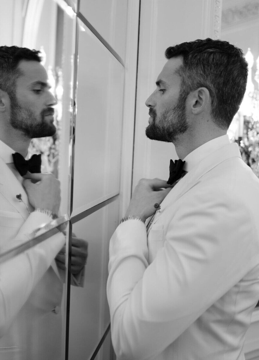 Kate Bock Kevin Love Wedding: Groom Kevin Love adjusting his tie before his wedding.