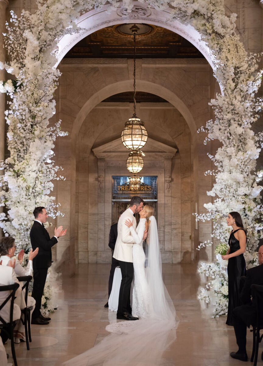 Kate Bock Kevin Love Wedding: Kate Bock and Kevin Love kissing at their wedding ceremony.