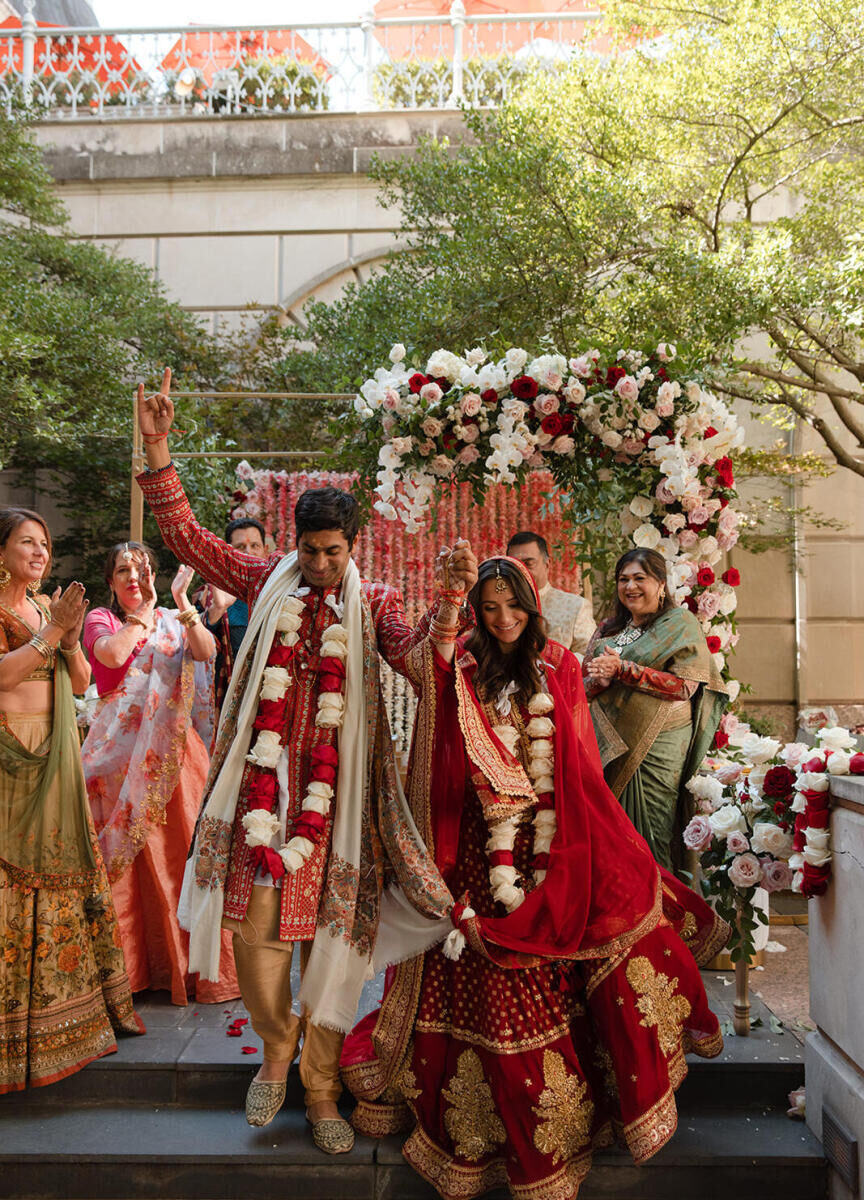 Marriott Weddings: A wedding couple celebrating after their ceremony in an outdoor courtyard in Dallas, Texas.