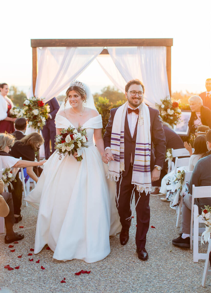 Marriott Weddings: A bride and groom during their processional at an outdoor venue in Carlsbad, California.