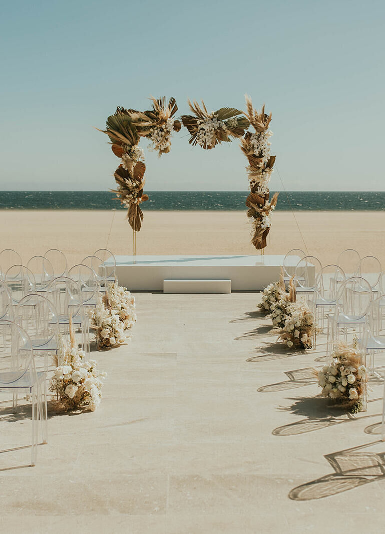 Mexican wedding: neutral bohemian beach ceremony set up overlooking the ocean