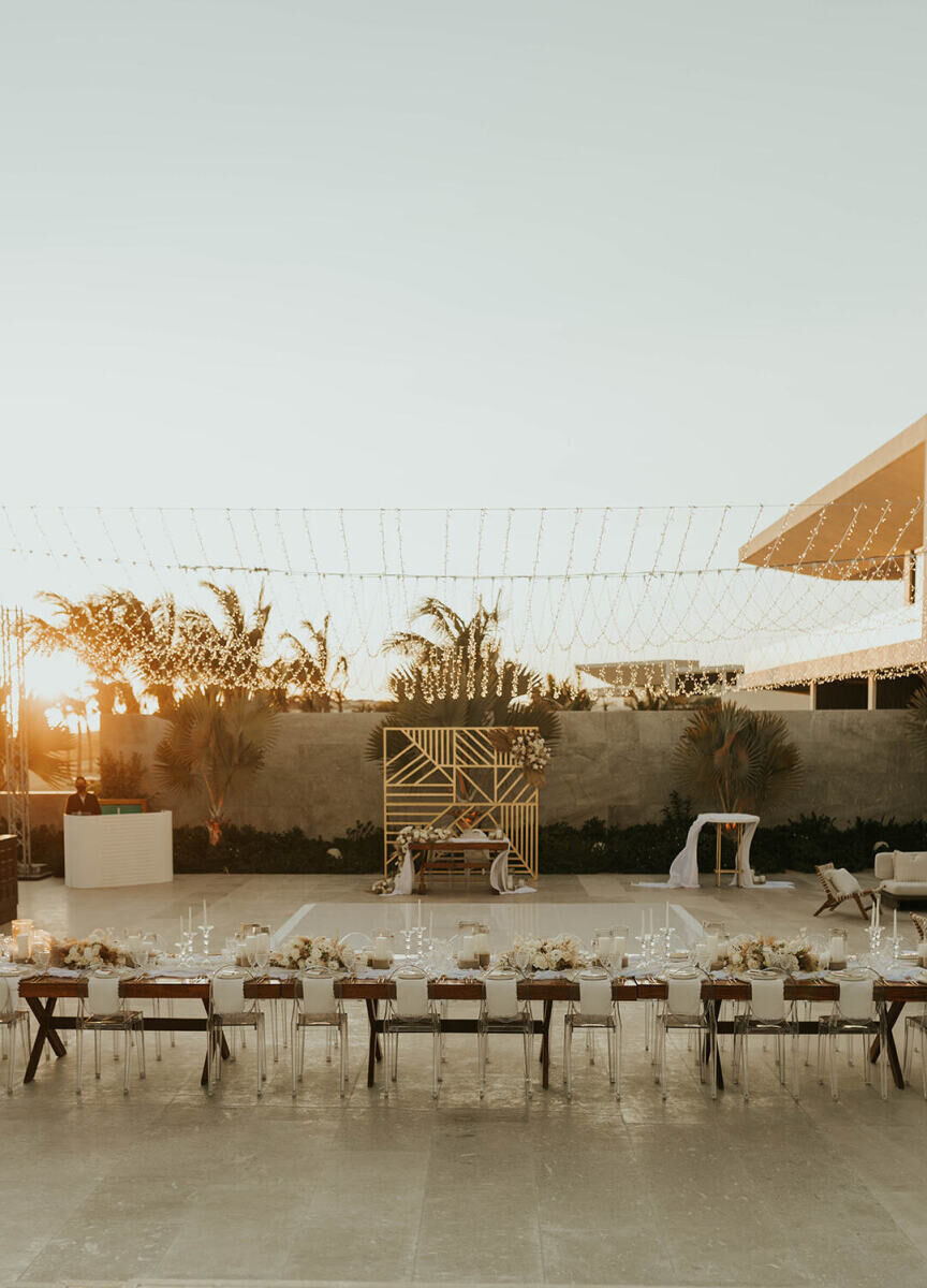 Mexican wedding: neutral white and gold, modern wedding reception, featuring long wood tables