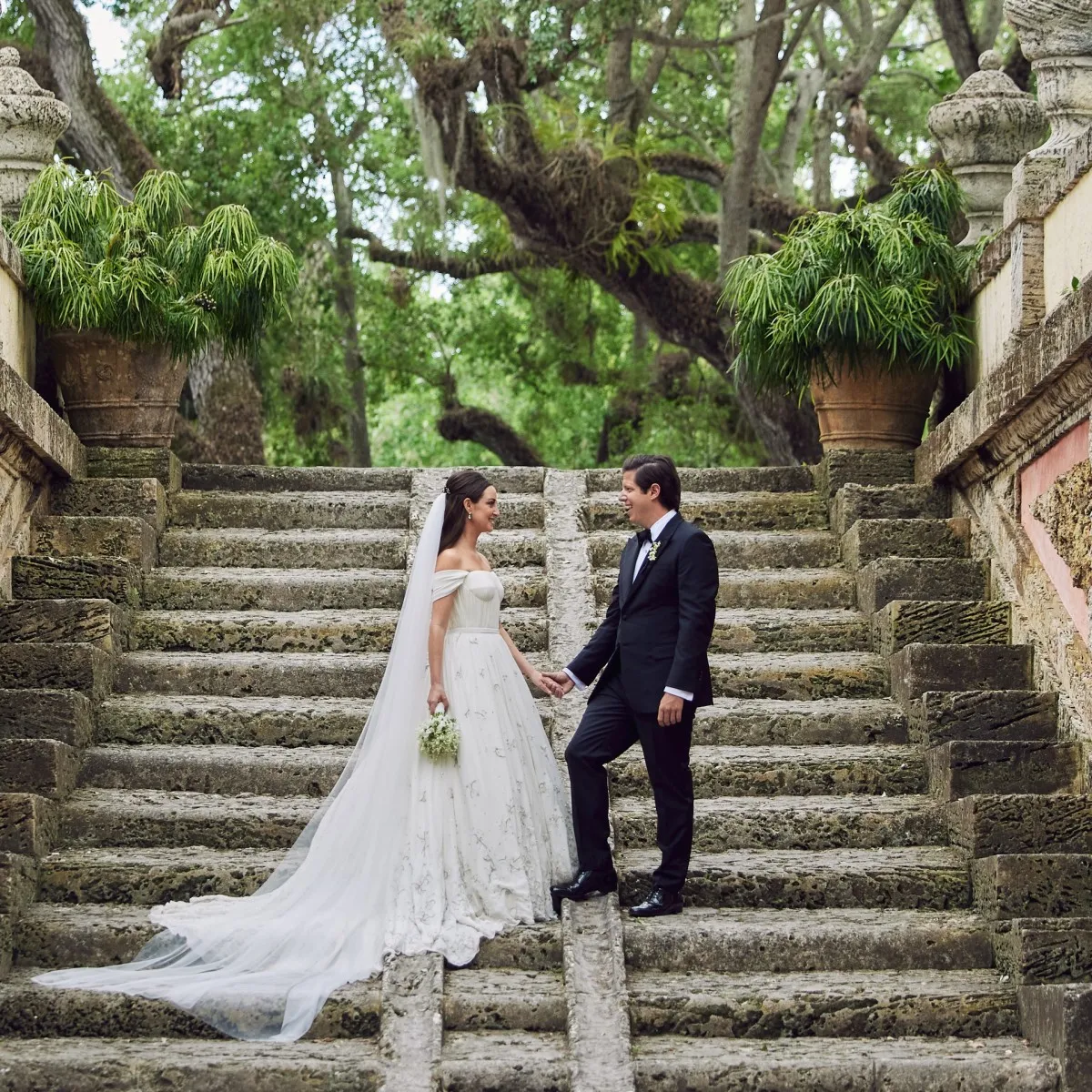 Celebrity stylist Micaela Erlanger and restaurateur Mac Osborne pose at their wedding at Miami's Vizcaya Museum & Gardens.