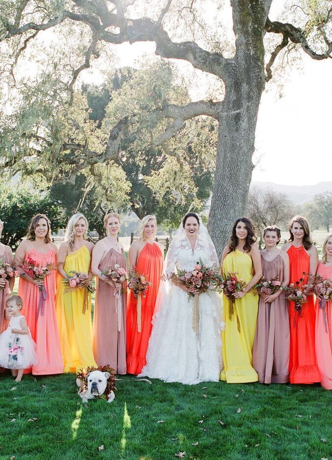 Mismatched bridesmaid dresses: See more assorted vibrant yellow and orange unique bridesmaid dresses from Kelsey and Cole's boho wedding