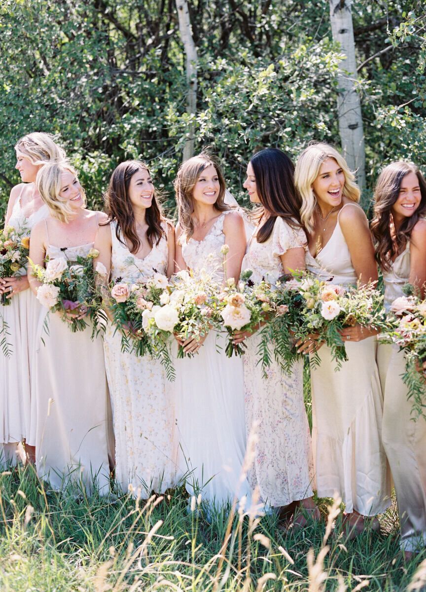 Mismatched bridesmaid dresses: See more assorted white unique bridesmaid dresses from Hannah and Will's country wedding