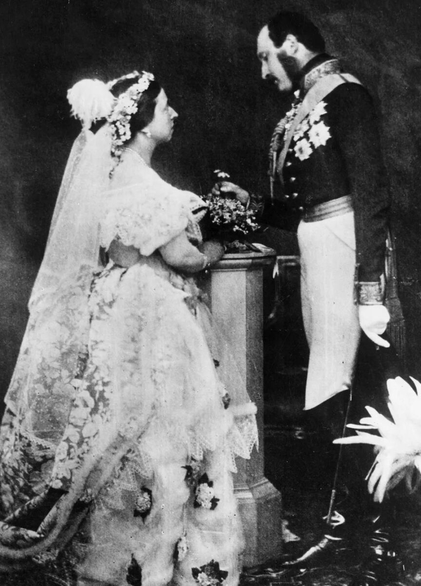 Most Influential Women in History Weddings: Queen Victoria in her wedding dress, posing for a portrait with husband Prince Albert