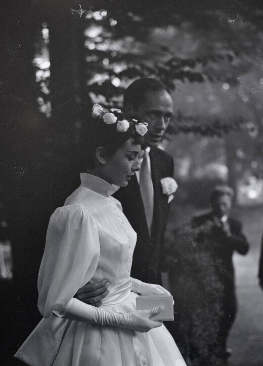 Most Influential Women in History Weddings: Audrey Hepburn walking in the trees with husband Mel Ferrer on their wedding day