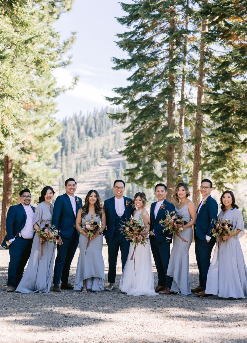 Mountain Wedding: A wedding party dressed in blue posing near a forest in Northern California.