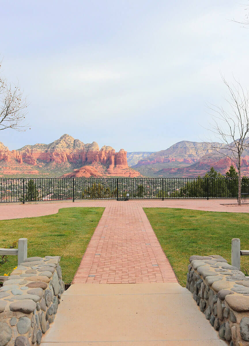 Mountain Wedding: An outdoor area at a hotel and wedding venue in Sedona, Arizona, with a pathway leading up to a view of the mountains.