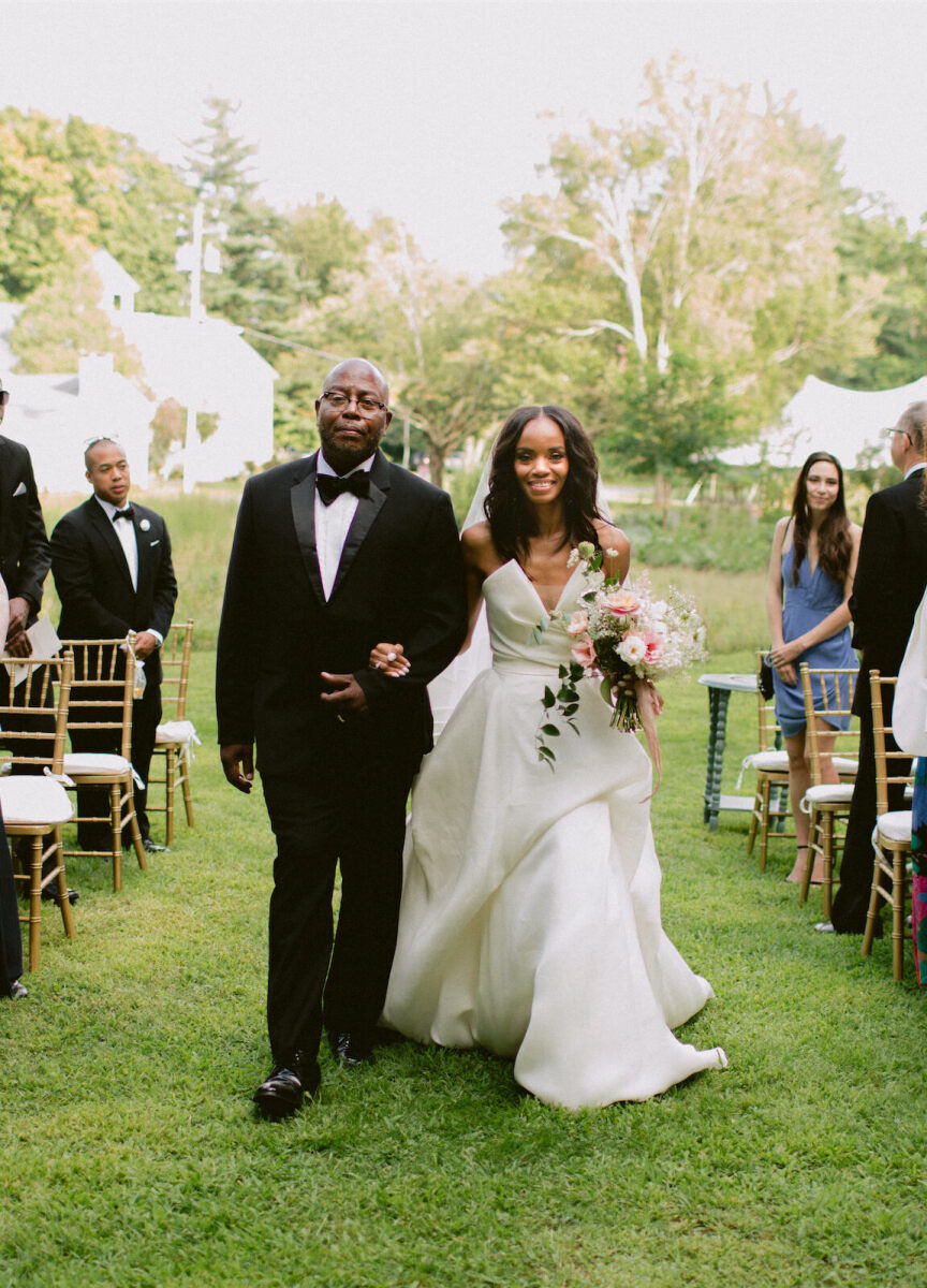 Mountain Wedding: A bride walking down the aisle with her father at an outdoor mountain wedding in New York.