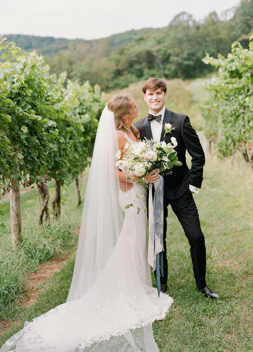 Pippin Hill Farm: A bride looking at a groom in the middle of a vineyard in Virginia.