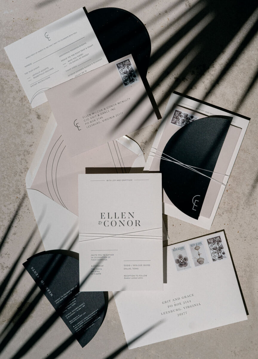 A modern black and white invitation suite with semi-circular accents was perfect for a contrast and art-loving bride and groom.