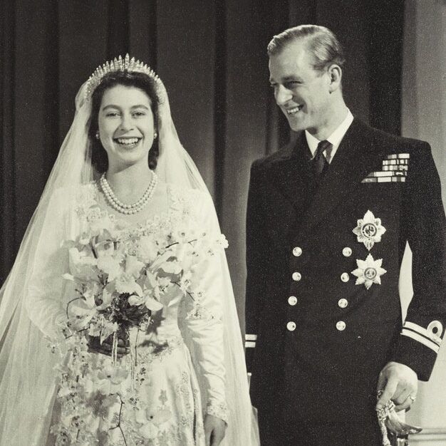 Royal Wedding Dresses: Queen Elizabeth and Prince Philip smiling on their wedding day.