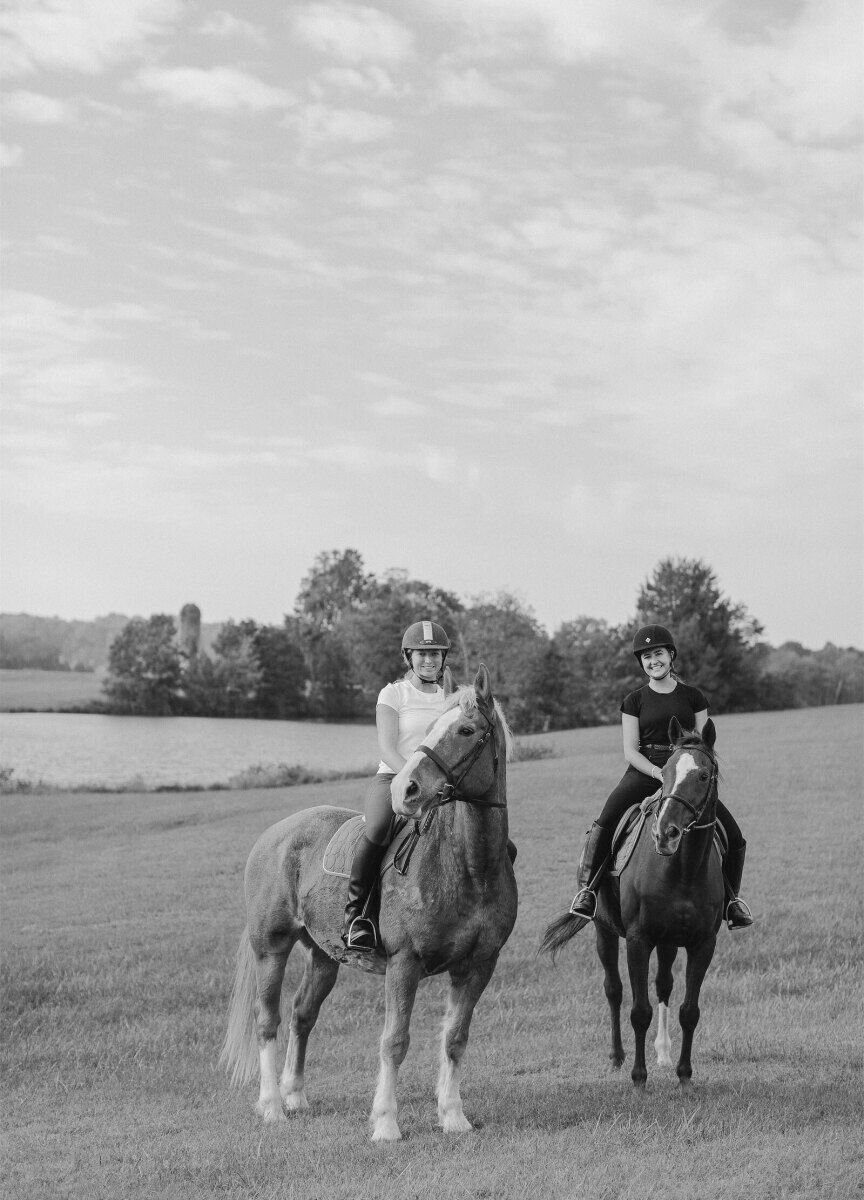 The morning of her rustic outdoor wedding, the bride and her friend went horseback riding at the wedding venue.