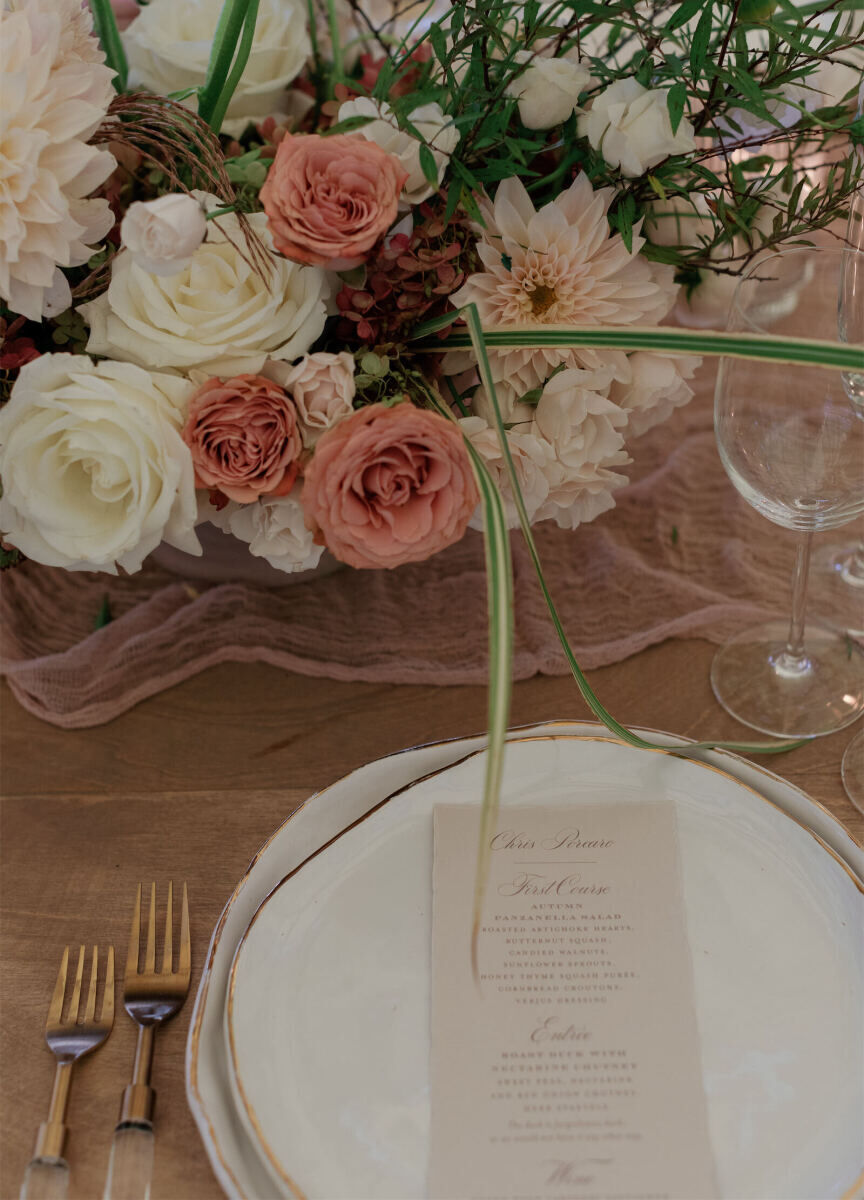 A menu card outlines the multi-course dinner for a rustic outdoor wedding, which included duck from a nearby farm.