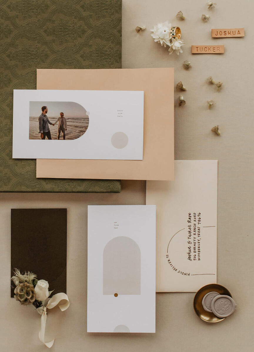 A modern invitation suite incorporated rounded elements, a photo of the grooms, and muted, neutral color palette.