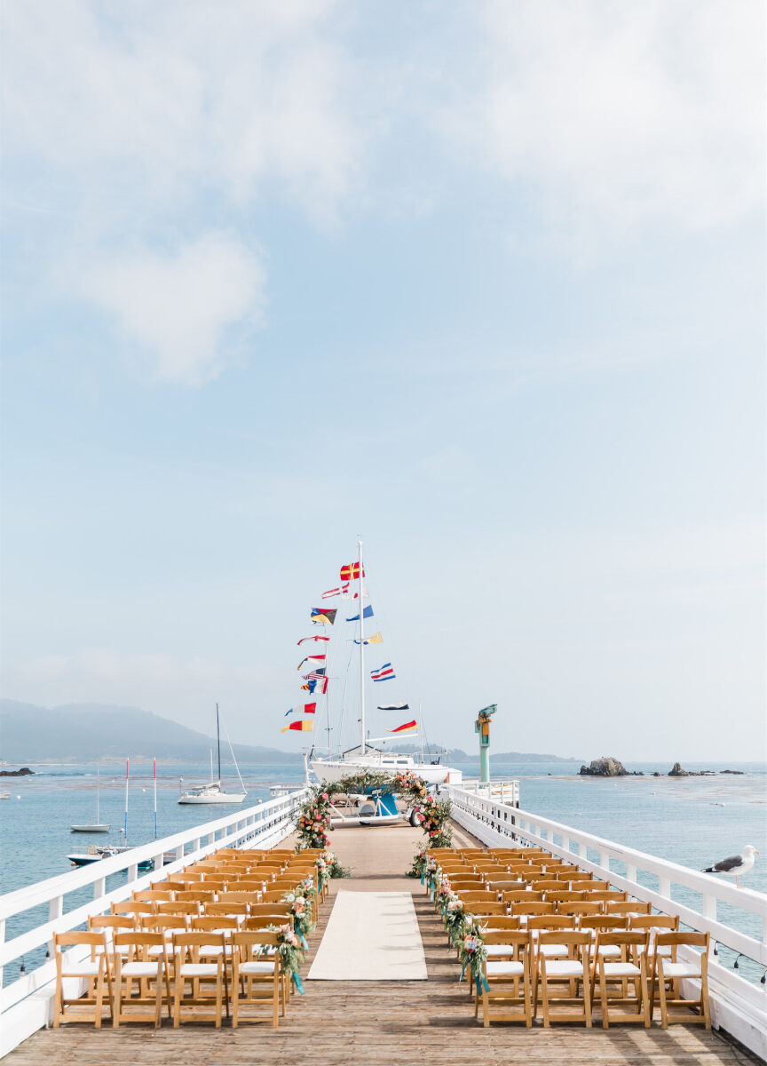 Wedding Aisle: An outdoor ceremony setup on a pier with wooden chairs and an arch, overlooking the ocean.